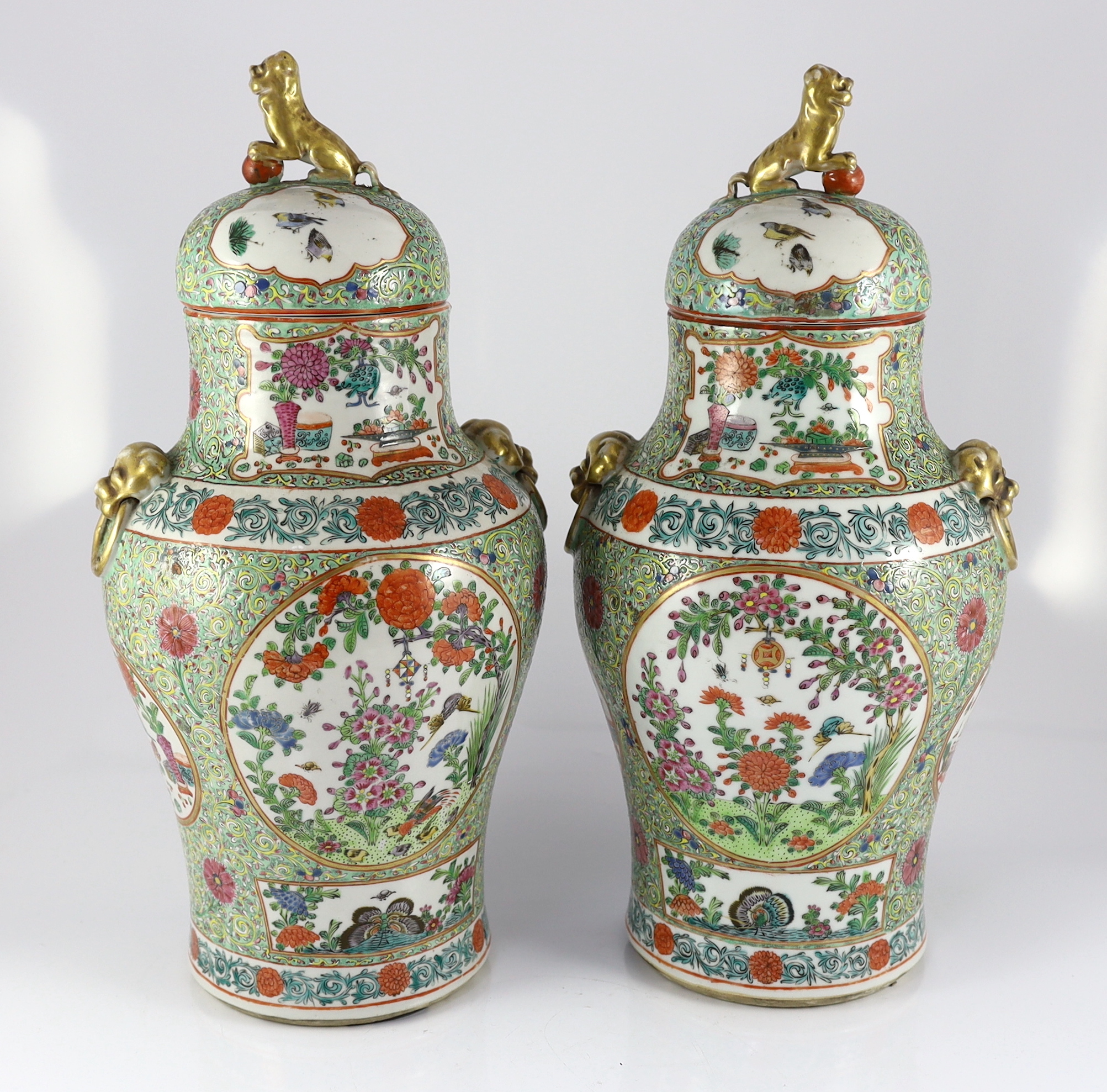 A pair of Chinese enamelled porcelain vases and covers, early 20th century